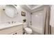 Bathroom includes a shower/tub combo, a mirror, and a sink at 6931 W 75Th Pl, Arvada, CO 80003