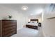 Bedroom features plush carpet, ample closet space, and natural light at 6931 W 75Th Pl, Arvada, CO 80003