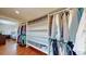 Spacious walk-in closet with built-in shelving and hanging racks, providing ample storage at 6931 W 75Th Pl, Arvada, CO 80003