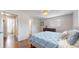 Beautiful bedroom with hardwood floors, en-suite bathroom, and relaxing atmosphere at 6931 W 75Th Pl, Arvada, CO 80003