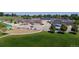 A neighborhood school with playgrounds, modern facilities, and solar panels, set in a well-maintained green space at 6931 W 75Th Pl, Arvada, CO 80003