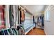 Spacious walk-in closet with extensive built-in shelving and hanging racks for optimal storage at 6931 W 75Th Pl, Arvada, CO 80003