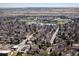 Breathtaking aerial perspective of community showcasing beautiful homes, a tranquil pond, and lush green spaces at 2610 Heidelberg Dr, Boulder, CO 80305