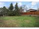 Large backyard featuring mature trees and fencing at 2610 Heidelberg Dr, Boulder, CO 80305