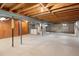 Unfinished basement with exposed beams and support posts at 2610 Heidelberg Dr, Boulder, CO 80305