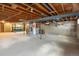 Spacious unfinished basement with exposed ceiling and concrete flooring at 2610 Heidelberg Dr, Boulder, CO 80305