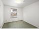 Neutral colored bedroom featuring gray carpet and a large window at 2610 Heidelberg Dr, Boulder, CO 80305