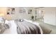 Bedroom featuring mirrored closet doors, gray carpet, and a king bed with white linens and pillows at 2610 Heidelberg Dr, Boulder, CO 80305