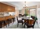 Bright dining area with a glass table, a view to the backyard, and easy access to the kitchen at 2610 Heidelberg Dr, Boulder, CO 80305