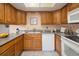 Galley kitchen with natural wood cabinets and stone countertops at 2610 Heidelberg Dr, Boulder, CO 80305