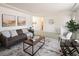 Comfortable living room featuring a modern sofa, stylish decor, and seamless flow to other rooms at 2610 Heidelberg Dr, Boulder, CO 80305