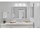 Updated bathroom featuring modern vanity, framed mirror, and new countertop at 14652 E 2Nd Ave # 200D, Aurora, CO 80011