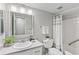 Comfortable bathroom featuring a shower, framed mirror, modern vanity and new countertop at 14652 E 2Nd Ave # 200D, Aurora, CO 80011