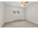 Inviting bedroom featuring a window providing ample natural light and carpet flooring at 14652 E 2Nd Ave # 200D, Aurora, CO 80011