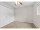 Bedroom with a double door closet, carpet flooring and a window providing natural light at 14652 E 2Nd Ave # 200D, Aurora, CO 80011