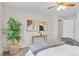 Bedroom featuring a decorative plant, minimalist side table, and window at 14652 E 2Nd Ave # 200D, Aurora, CO 80011