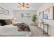 Bedroom with a comfortable bed, window view, and side table at 14652 E 2Nd Ave # 200D, Aurora, CO 80011