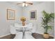 Modern dining area featuring a white round table and contemporary decor at 14652 E 2Nd Ave # 200D, Aurora, CO 80011