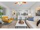 Open-concept living room with views to the kitchen and dining areas at 14652 E 2Nd Ave # 200D, Aurora, CO 80011