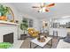 Cozy living room with a white brick fireplace, plush seating, and lots of natural light at 14652 E 2Nd Ave # 200D, Aurora, CO 80011