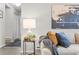 Living room showcasing a cozy sofa with pillows and throws, and a decorative side table at 14652 E 2Nd Ave # 200D, Aurora, CO 80011
