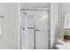Clean shower with a glass sliding door and grab bar at 14652 E 2Nd Ave # 200D, Aurora, CO 80011