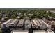 Aerial view of modern townhomes with rooftop decks and mature trees surrounding the area at 4537 N Tennyson St # 101, Denver, CO 80212