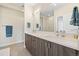 Modern bathroom features a double vanity, stylish fixtures, and a glass-enclosed shower at 4537 N Tennyson St # 101, Denver, CO 80212