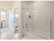 Bright bathroom featuring a glass enclosed shower with white subway tile and modern fixtures at 4537 N Tennyson St # 101, Denver, CO 80212