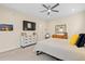 Bright primary bedroom featuring a ceiling fan, carpet floors, and ample natural light at 4537 N Tennyson St # 101, Denver, CO 80212