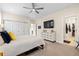 Primary bedroom featuring ensuite with walk-in closet and carpet floors at 4537 N Tennyson St # 101, Denver, CO 80212