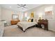 Bright bedroom featuring a ceiling fan, dresser, and natural light at 4537 N Tennyson St # 101, Denver, CO 80212