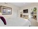 Bright bedroom with a comfortable bed, modern decor, and an adjacent bathroom and office space at 4537 N Tennyson St # 101, Denver, CO 80212