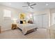 Comfortable bedroom featuring a ceiling fan, double-door closet, and neutral decor at 4537 N Tennyson St # 101, Denver, CO 80212