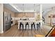 Kitchen with stainless steel appliances, large island, and modern light fixtures at 4537 N Tennyson St # 101, Denver, CO 80212