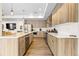Spacious kitchen boasts stainless appliances, a large island, and pendant lighting at 4537 N Tennyson St # 101, Denver, CO 80212