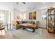 Bright living room with hardwood floors, modern furniture, and an open concept design at 4537 N Tennyson St # 101, Denver, CO 80212
