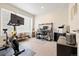 A well-lit office features a large window, modern desk setup, and exercise equipment at 4537 N Tennyson St # 101, Denver, CO 80212