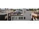 A rooftop patio with outdoor seating and views of the surrounding area at 4537 N Tennyson St # 101, Denver, CO 80212