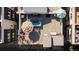 Aerial view of a furnished rooftop patio with umbrellas and outdoor seating at 4537 N Tennyson St # 101, Denver, CO 80212