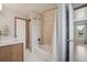 Bathroom features bathtub and shower combination with tile surround and storage at 280 Pierce St, Erie, CO 80516
