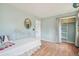 Bedroom featuring hardwood floors, modern furniture and a sizable closet with curtains at 280 Pierce St, Erie, CO 80516
