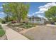 Inviting home with a lovely front yard featuring native plants and a cozy porch for relaxing outdoors at 280 Pierce St, Erie, CO 80516
