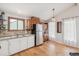 Eat-in kitchen with wood floors and stainless steel refrigerator at 280 Pierce St, Erie, CO 80516