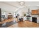 Open concept kitchen featuring stainless appliances, wood floors, and bar seating at 280 Pierce St, Erie, CO 80516