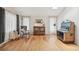 Bright living room featuring hardwood floors, a vintage jukebox, and modern decor at 280 Pierce St, Erie, CO 80516