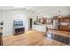 Open concept living room leading to an updated kitchen featuring hardwood floors and lots of natural light at 280 Pierce St, Erie, CO 80516