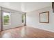 Spacious, bright living room with wood floors and neutral paint at 280 Pierce St, Erie, CO 80516