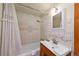 Bathroom featuring a shower and tub combination with vintage floral-themed tiles at 420 Chinook Rd, Idaho Springs, CO 80452