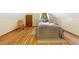 Bedroom featuring hardwood floors and a charming bed with a wooden chair at 420 Chinook Rd, Idaho Springs, CO 80452